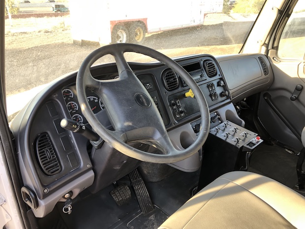 2009 Freightliner M2 106 4,250 Gallon Water Truck. Cab view of steering wheel and dash.