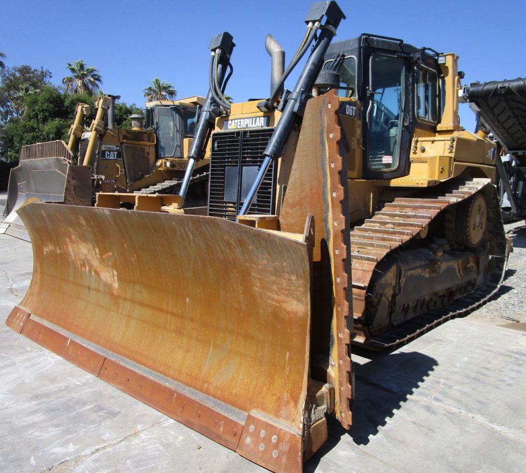2012 CAT D6T XL. Front left view, cab blade and slope blade.