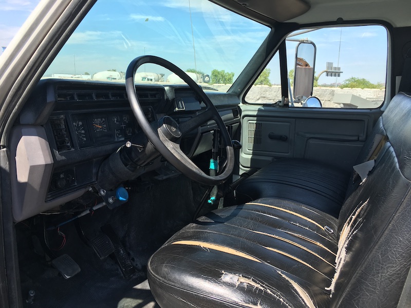 1999 Ford F800 Water Truck. In cab vide of drivers seat.