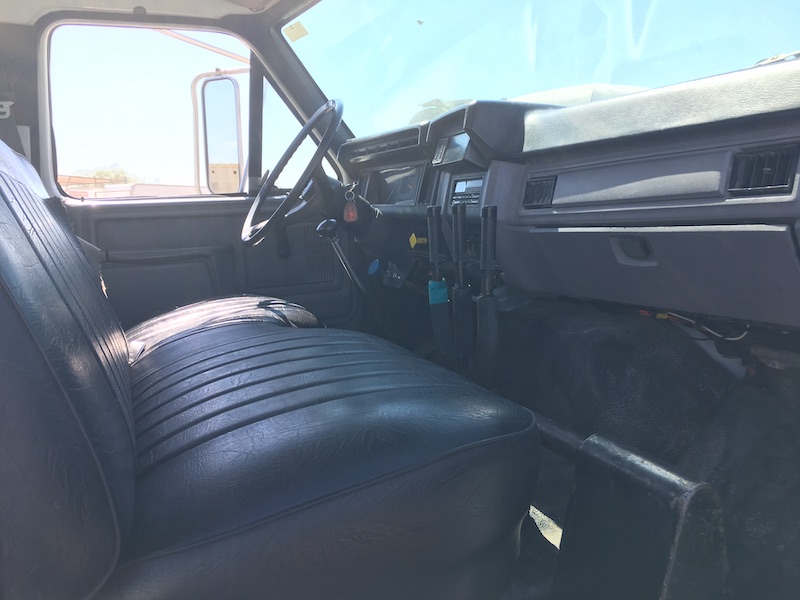 1999 Ford F800 Water Truck. In cab vide of passenger seat.