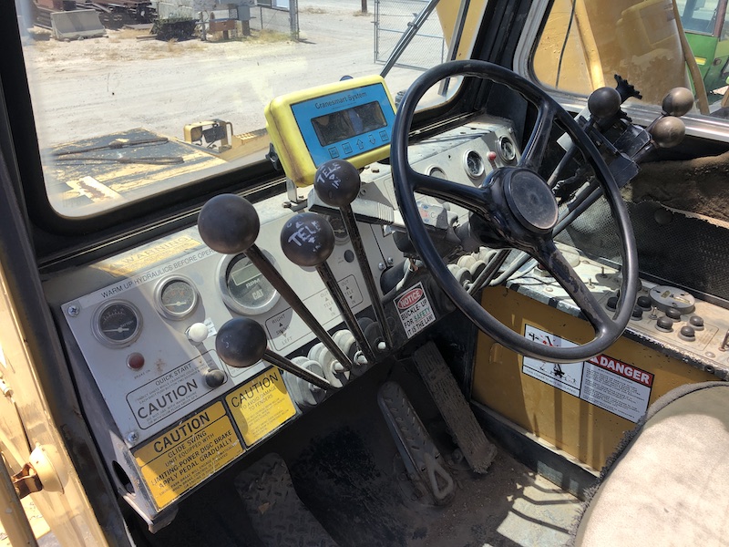 1981 Grove RT980. In cab controls and steering wheel.